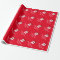 Red Christmas wrapping paper with funny monogram
