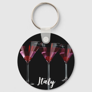 Red cocktails in martini glass with cherry key ring