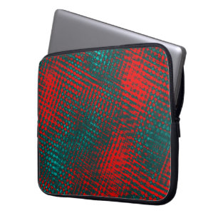Red crisscrossing scratches over charred cyan      laptop sleeve