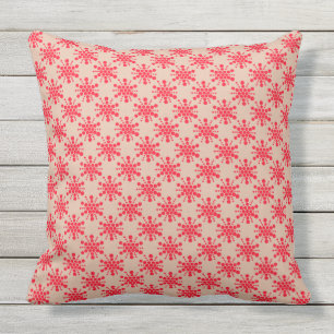 Red dotted star on taupe cushion