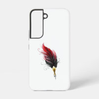 Red feather pen with gold nib