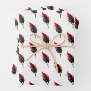 Red feather pen with gold nib wrapping paper sheet