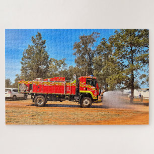Red fire truck spraying water on road, Australia Jigsaw Puzzle
