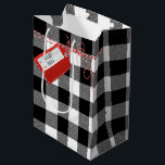 Red Gift Tag On Buffalo Plaid Medium Gift Bag<br><div class="desc">Red gift tag with a striped string bow on white-and-black buffalo plaid.
Names on the red tag can be edited</div>