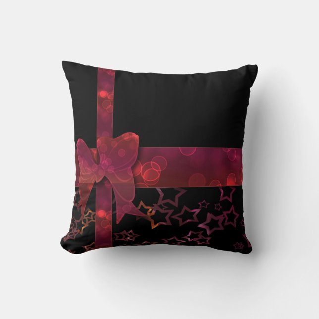 Red glitter bow and stars on black cushion (Front)