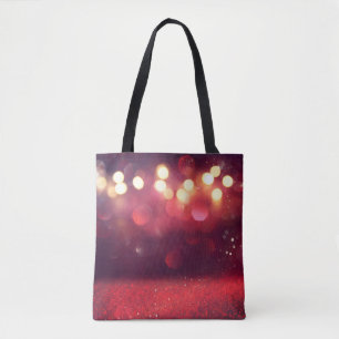Red glitter vintage lights background. defocusedba tote bag