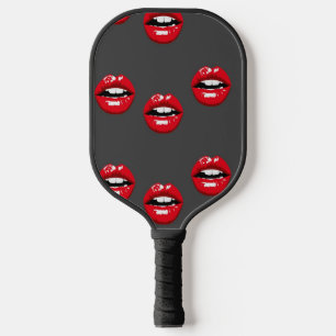 Red glossy lips on grey pickleball paddle
