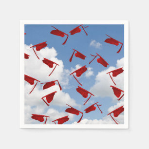 Red graduation caps in sky napkin