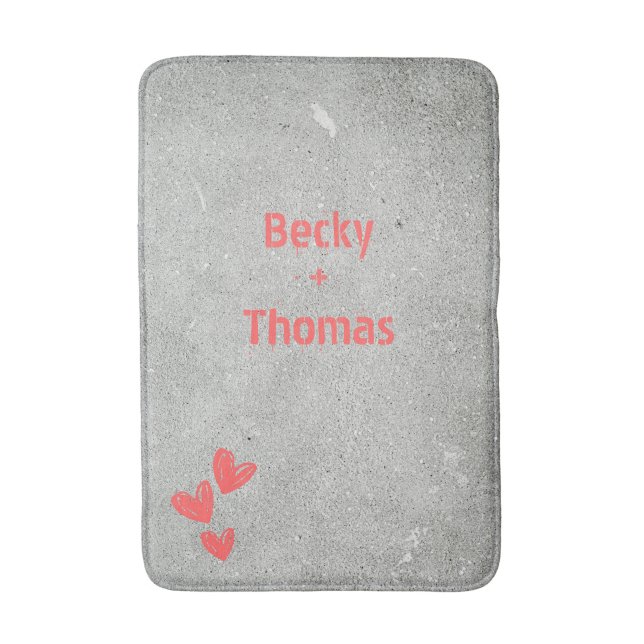 Red graffiti name on grey concrete, your  bath mat (Front Vertical)