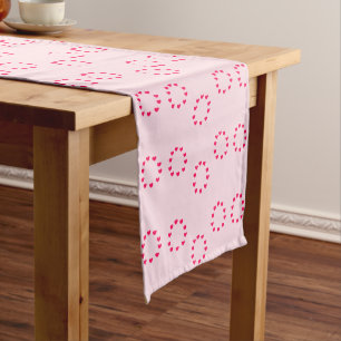 red heart circles on pink short table runner