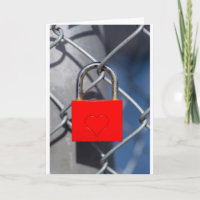Red heart lock on fence