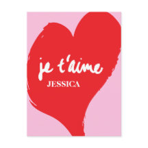 Red heart with je t’aime-text on pink background