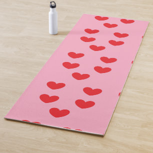 Red hearts on pink yoga mat