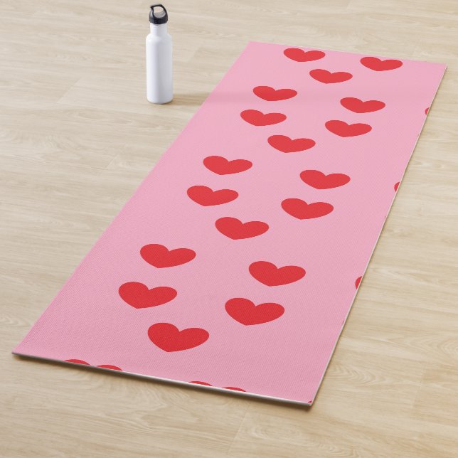 Red hearts on pink yoga mat (In Situ)