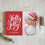 Red Holly Jolly Hand Lettering Baby Photo Holiday Card<br><div class="desc">Festive Holly Jolly Hand Lettered Photo Holiday Card | Send festive holiday greetings to family and friends with this customisable holiday flat card. It features a hand-lettered "holly jolly" overlay with snow and snowflakes accent. Customise by adding your favourite photo. Matching items are available.</div>