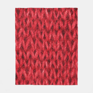 Red knitting wool texture background. fleece blanket