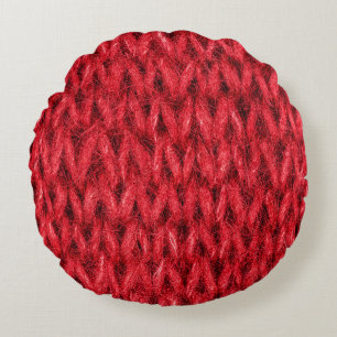 Red knitting wool texture background. round cushion