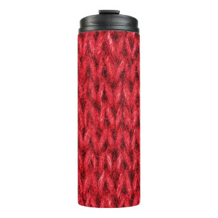 Red knitting wool texture background. thermal tumbler