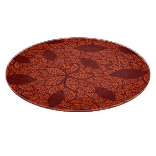 Red leaves pattern on orange cutting board
