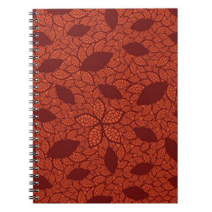 Red leaves pattern on orange notebook