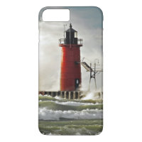 red lighthouse with giant wave