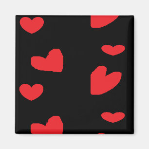 Red love hearts on black magnet