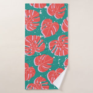 Red monstera leaves on green seamless pattern. Tre Bath Towel