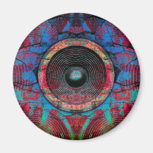 Red music speakers on a cracked wall magnet