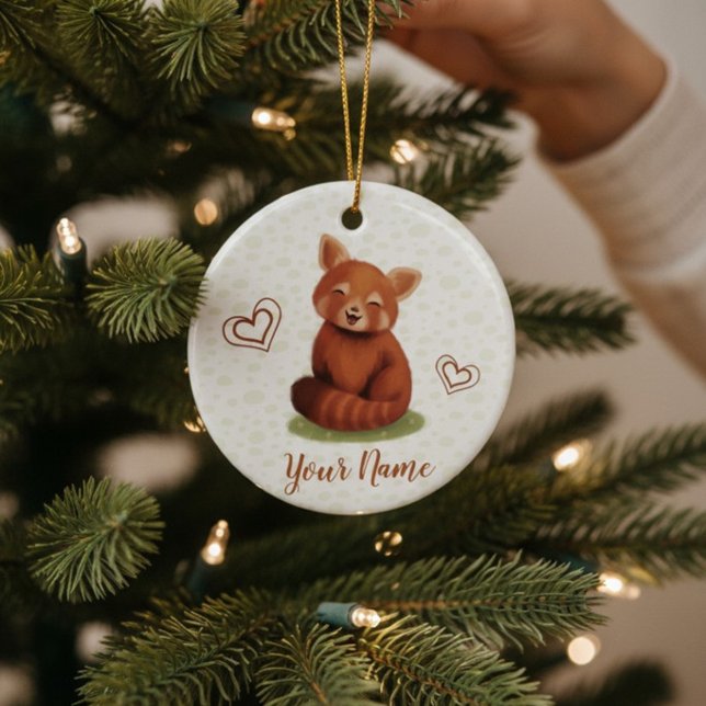 Red Panda Personalized Name Ceramic Ornament (Cute red panda Christmas Ornament with hand-painted name, being hung on a tree for the holidays.)