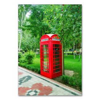 Red payphone booth in the Melitopol park Table Number