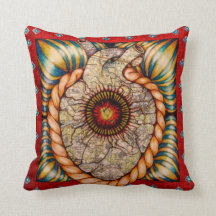 Red pillow with heart and maps