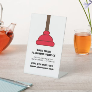 Red plunger plumbing services company logo office pedestal sign