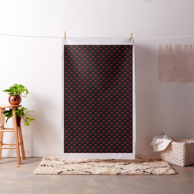 Red polka crosses on black fabric (In Situ)