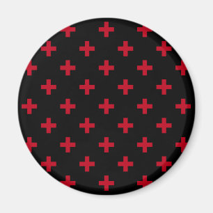 Red polka crosses on black magnet