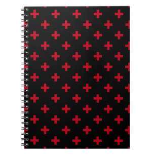 Red polka crosses on black notebook