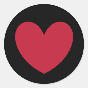 Red polka hearts on black classic round sticker
