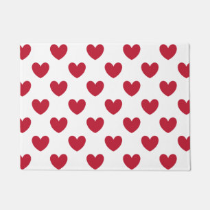 Red polka hearts on white doormat