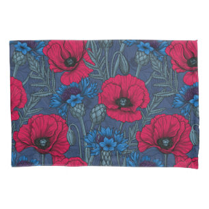 Red poppies and blue cornflowers on blue pillowcase