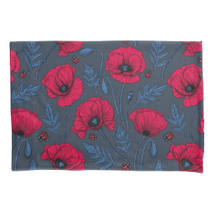 Red poppies and ladybugs on dark blue pillowcase