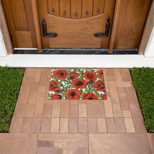 Red poppies and wrens, green leaves on white doormat (Outdoor)