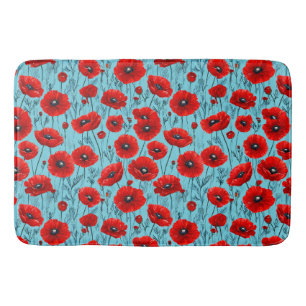 Red poppies flowers on a blue background bath mat
