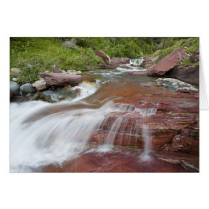Red rock in Baring Creek in Glacier National