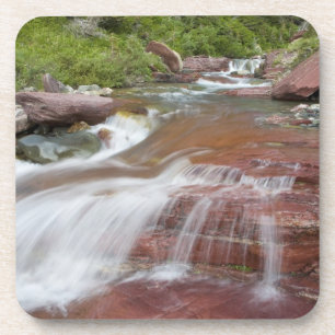 Red rock in Baring Creek in Glacier National Coaster