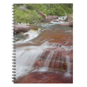 Red rock in Baring Creek in Glacier National Spiral Notebook