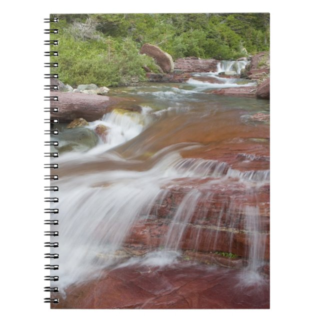 Red rock in Baring Creek in Glacier National Spiral Notebook (Front)