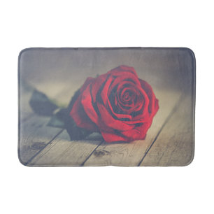 Red Rose on Wooden Floorboards Art Print bathmat