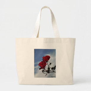 Red Roses Against a Bright Blue Sky Large Tote Bag