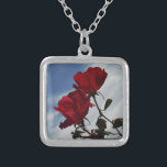Red Roses Against a Bright Blue Sky Silver Plated Necklace<br><div class="desc">Red Roses Against a Bright Blue Sky Photo by Sandy Closs,  taken at Lake Arrowhead. "red rose""red roses""pink rose""pink roses""weddings""love gift""red flower""red flowers""red floral" red blue rose roses "gifts with roses"</div>