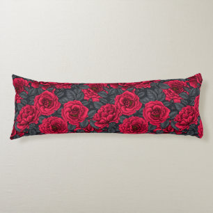 Red roses with gray leaves on black body cushion
