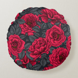 Red roses with grey leaves on black round cushion